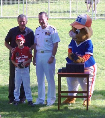 Seven-year-old Eric Anderson stands with President George W. Bush, Chairman of the Joint Chiefs of Staff, Navy Adm. Mike Mullen and the Little League mascott during a Tee Ball game on the South Lawn of the White House Sept. 7. Eric is the son of Lt. Col. Leighton and Kristi Anderson, 1st Special Operations Support Squadron. He was one of only 26 players selected for the game, which included children with parents serving on active-duty in the Air Force, Army, Coast Guard, Navy or Marines.  (U.S. Air Force photo)