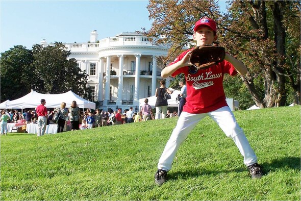 Seven-year-old Eric Anderson, son of Lt. Col. Leighton and Kristi Anderson, 1st Special Operations Support Squadron, stands ready in the outfield during a Tee Ball game on the South Lawn of the White House Sept. 7. Eric was one of only 26 players selected for the game, which included children with parents serving on active-duty in the Air Force, Army, Coast Guard, Navy or Marines. Eric caught the only pop-fly in the game. (U.S. Air Force photo)