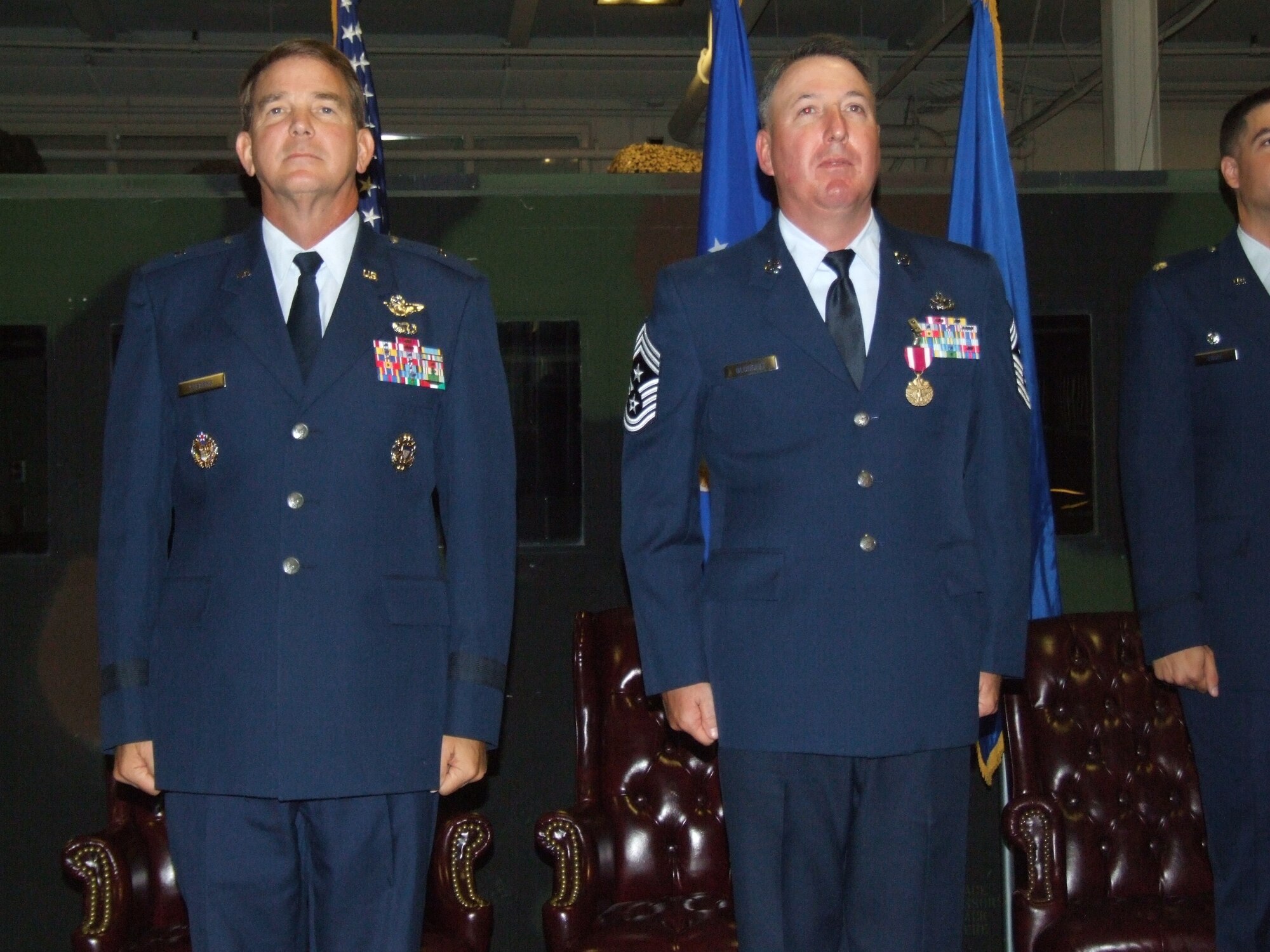 Chief Master Sgt. Bruce Blodgett stands during his retirement ceremony Oct. 3. Chief Blodgett retired as the 15th Expeditionary Mobility Task Force command chief after more than 27 years of service. During his time as command chief for the 15th EMTF, Chief Blodgett provided leadership and direction to more than 2,000 enlisted technicians and operators in 52 different Air Force specialties supporting 20 locations throughout the United States, the Pacific and Asia.  (U.S. Air Force photo/Senior Airman Charles Slayton)

