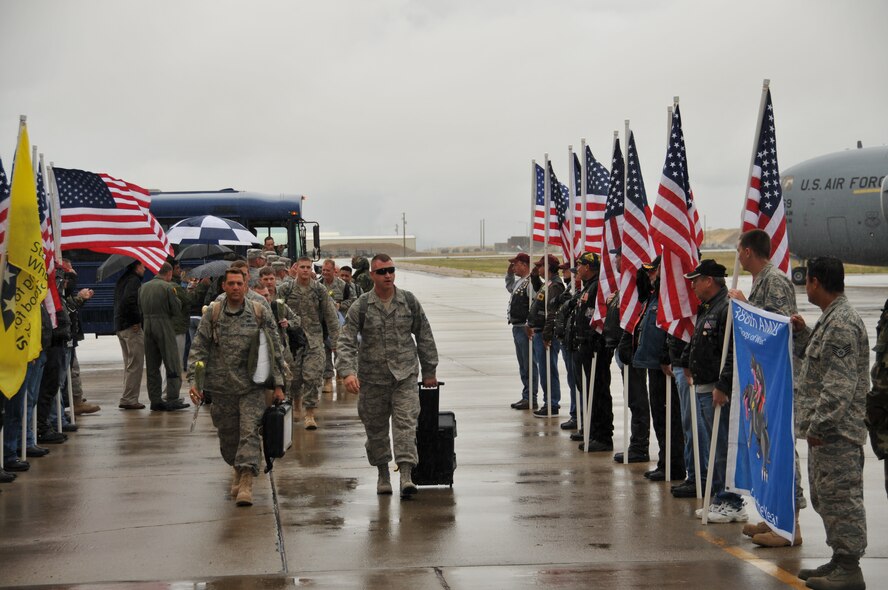 Members of the 419th and 388th Fighter Wings return to Hill Air Force Base Oct. 5. Despite the rain, family and friends gathered at Building 900 to greet the more than 300 men and women coming home after a 120-day deployment to Iraq. The 419th returnees included about 30 Airmen from the 419th Maintenance Group.  (Courtesy photo) 