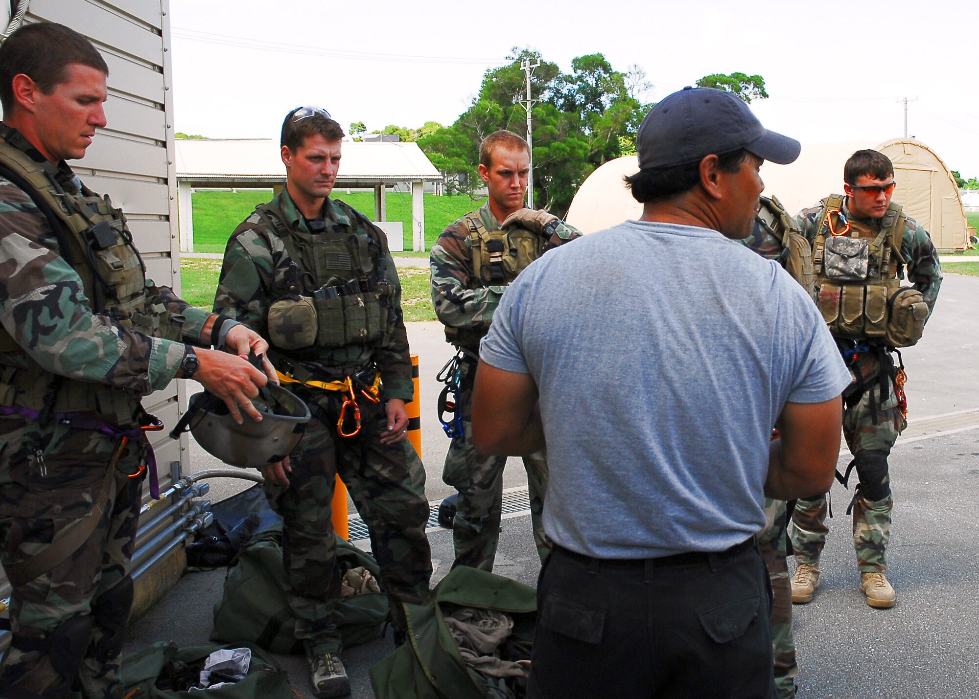Members of the 31st Rescue Squadron at Kadena Air Base, Japan, prepare for an exercise scenario during confined-space training Oct. 3. The training prepares them to execute rescue operations in confined spaces and collapsed structures.  (U.S. Air Force photo/Airman 1st Class Amanda Grabiec)