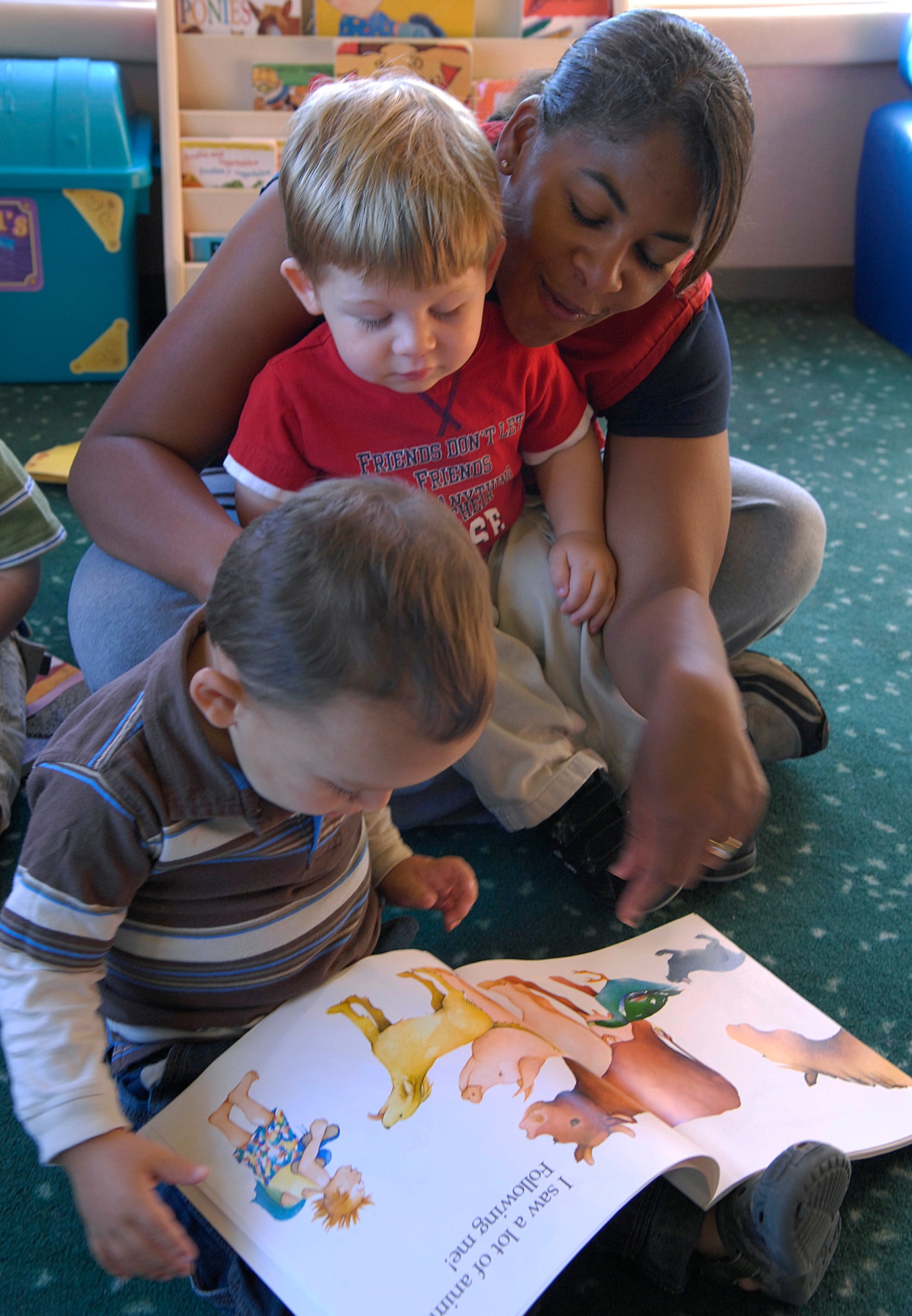 VANDENBERG AIR FORCE BASE, Calif. --  Shannon Trollio, an employee at the Child Development Center here, reads a book to the children in class during story time  Sept. 25.   (U.S. Air Force Photo/ Airman 1st Class Andrew Lee)