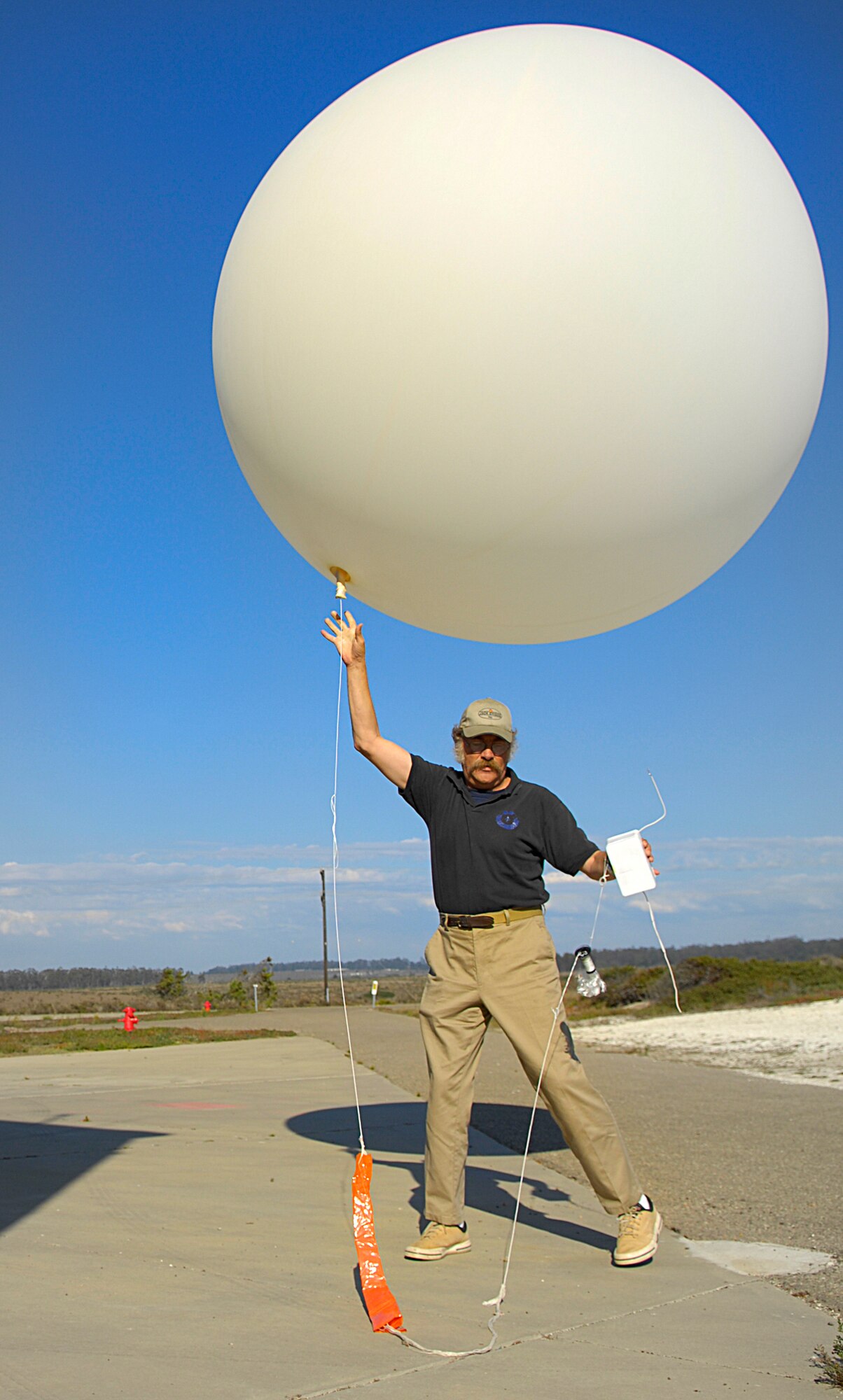 VANDENBERG AIR FORCE BASE, Calif. --  Brad Barclay, a Vandenberg weather/upper air observer contractor, launches a weather balloon to get the upcoming weather information on a thunder storm in the forecast here Sept. 29. (U.S. Air Force Photo/ Airman 1st Class Andrew Lee)