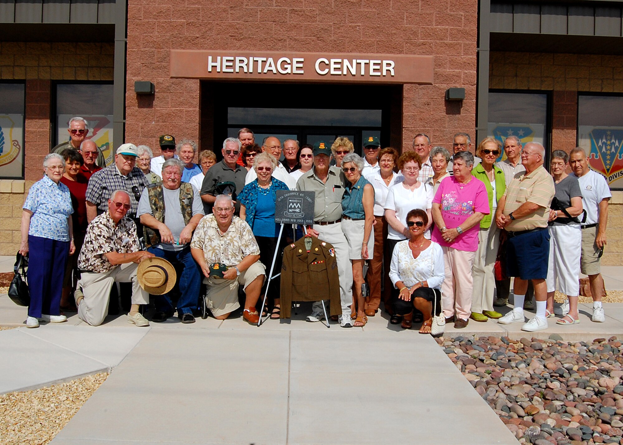 Members of the 12th Ordinance Battalion (Special Weapons Depot) pose with their wives in front of the Heritage Center located at Holloman Air Force Base, N.M., September 26. The 12th Ordinance Battalion donated a stone marker to be placed at Heritage Park.(courtesy photo) 