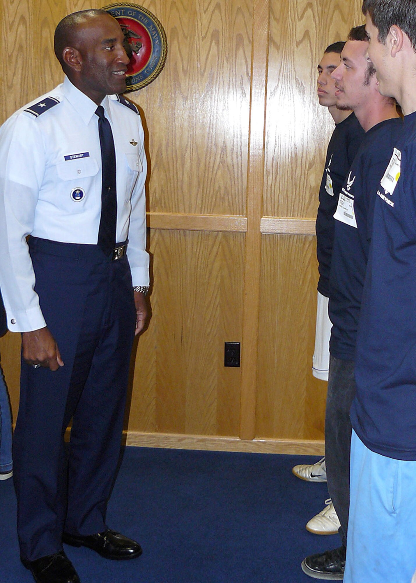 Brig. Gen. A.J. Stewart meets members of the 364th Recruiting Squadron Delayed Entry Program Sept. 23 during a week-long visit of the squadron. The Air Force Recruiting Service commander administered the oath of enlistment for nine of the future Airmen during a swearing in ceremony at the Sacramento Military Entrance Processing Station in California that day. (U.S. Air Force photo/Staff Sgt. Justin Gress)