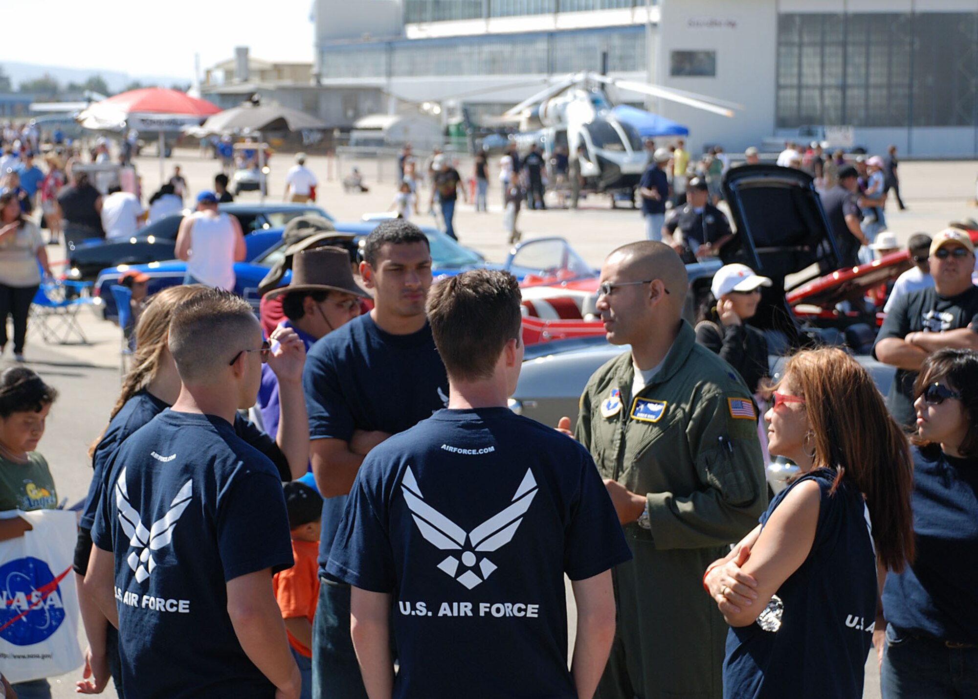 Lt. Col. Ruben Rios, 364th Recruiting Squadron commander, coaches Delayed Entry Program members Sept. 27 before a public swear-in ceremony at the California International Air Show in Salinas. In addition to affirming the dedication of the future Airmen to serve their nation, the public ceremony drew the attention of air show enthusiasts and members of the 364th RCS were on hand to answer questions. (U.S. Air Force photo/Staff Sgt. Justin Gress)