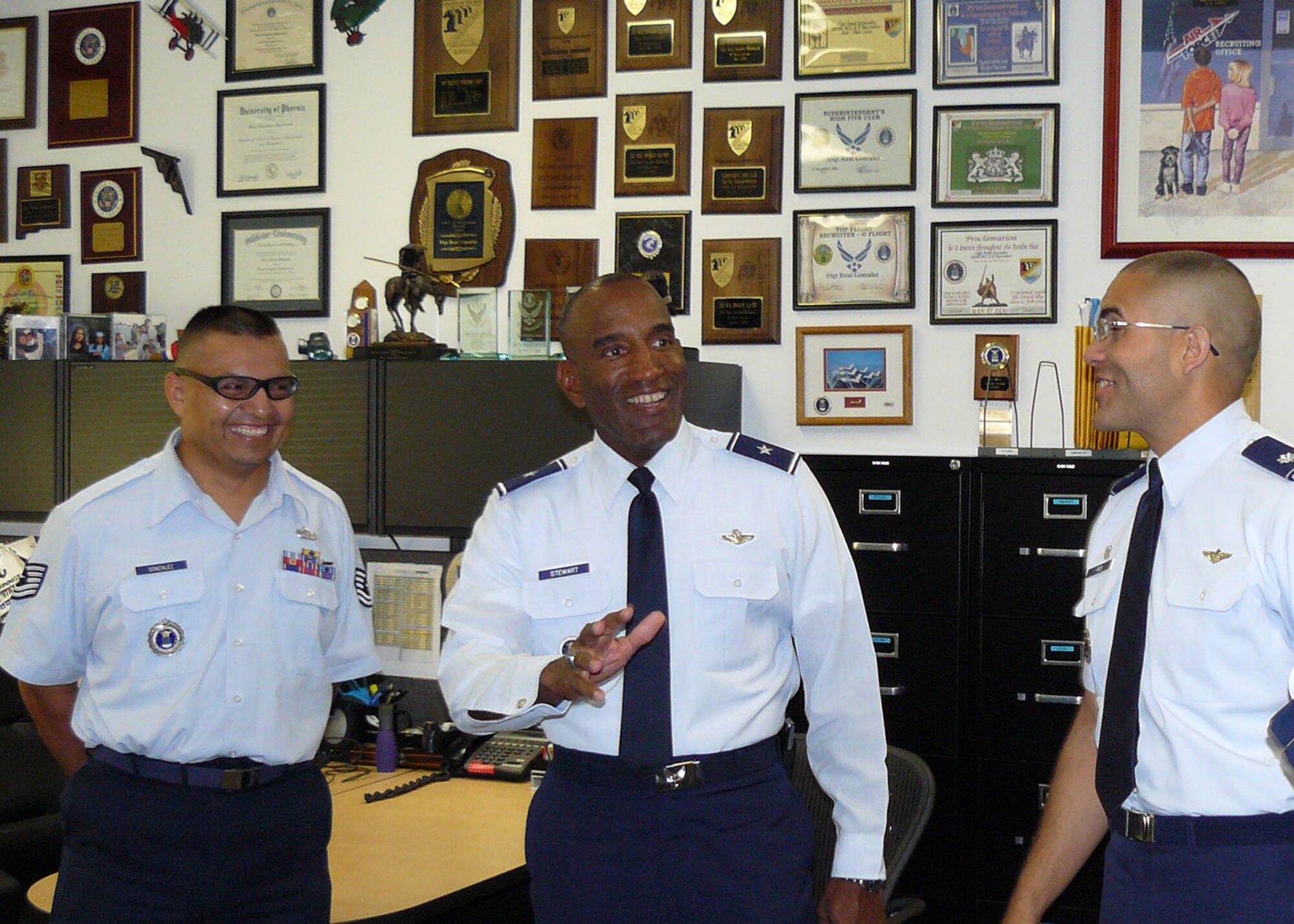 Lt. Col. Ruben Rios, right, and Tech. Sgt. Raul Gonzalez, left, give Brig. Gen. A.J. Stewart a tour of the Sacramento Military Entrance Processing Station in California Sept. 23. The 364th Recruiting Squadron commander and MEPS liaison, respectively, introduced the Air Force Recruiting Service commander to the MEPS team and showcased outstanding unit practices. (U.S. Air Force photo/Staff Sgt. Justin Gress)