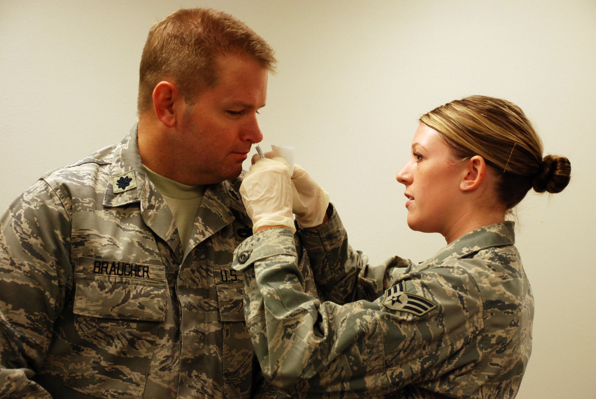 Senior Airman Brittany Deziel, a medical technician in the 82nd Medical Operations Squadron, gives Lt. Col. Michael Braucher, 365th Training Squadron commander, a flu vaccination with a nasal spray. Medical technicians began administering flu vaccinations to Sheppard personnel Oct. 8 to prepare for the upcoming flu season. (U.S. Air Force photo/Airman 1st Class Candy Miller)