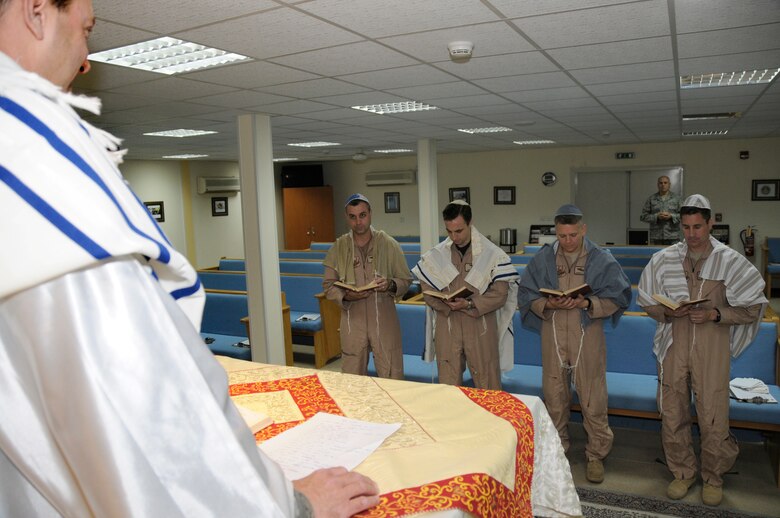 SOUTHWEST ASIA -- Capt. Gary Davidson, a Jewish Rabbi, leads a few members of the 380th Expeditionary Airborne Air Control Squadron in worship here Oct. 8. Rabbi Davidson deployed for one month to the Area of Operations to perform religious services for deployed Jewish members. He will be dividing his time spent away from the U.S. Air Force Academy at three different locations during some of the most important Jewish holidays of the year. (U.S. Air Force photo/Tech. Sgt. Christopher A. Campbell)(released)