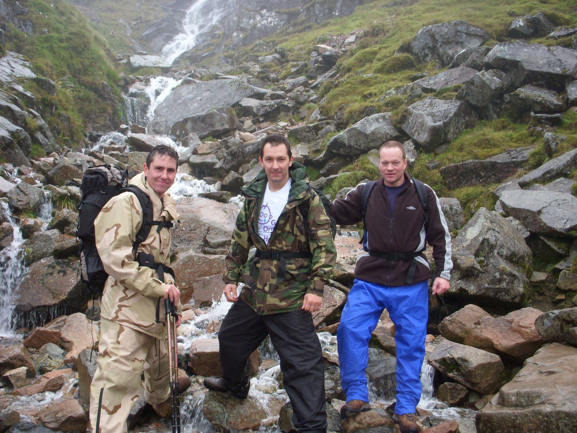 Defence Fire Service firefighters Chris Gould, Alan Coldwell and Jerry Myles, all 100th Civil Engineer Squadron Fire Department, pose for a photo after climbing Ben Nevis, Scotland on the first leg of their Three Peaks Challenge. They also climbed Scaffel Pike, England, and Mount Snowdon, Wales, where they took part in rescue efforts to save a man who was suffering from hypothermia and frostbite. (Courtesy photo)