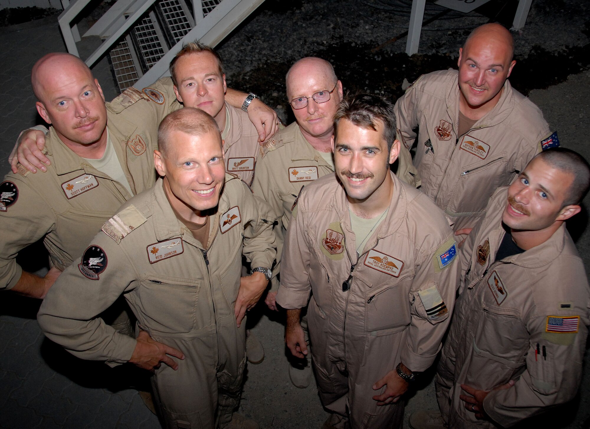 SOUTHWEST ASIA -- Members of four coalition countries are united in one U.S. Air Force deployed unit. Americans, Australians, British and Canadians are flying operational sorties on the same crew for what is likely to be the first time in history. The 965th Expeditionary Airborne Air Control Squadron is the first unit of its kind to deploy to this location with three different coalition partners as squadron members. To take it a step further, all four coalition members can be found on the same aircraft flying operational sorties. The unit, from Tinker Air Force Base's 552nd Air Control Wing in Oklahoma, brought Australian, British and Canadian members who are assigned to the 965th EAACS at home station into the Area of Responsibility with them. Left to right back row: Canadian Maj. Scott Hoffman, British Flt. Lt. Matt Brunton, Canadian Sgt. Danny Reid, Australian Flt. Lt. Nathan Yabsley; left to right front row: Canadian Capt. Reid Johnson, Australian Flt. Lt. Troy Roempke, American 1st Lt. Alexander Demma. (U.S. Air Force photo by Tech. Sgt. Denise Johnson) (released)