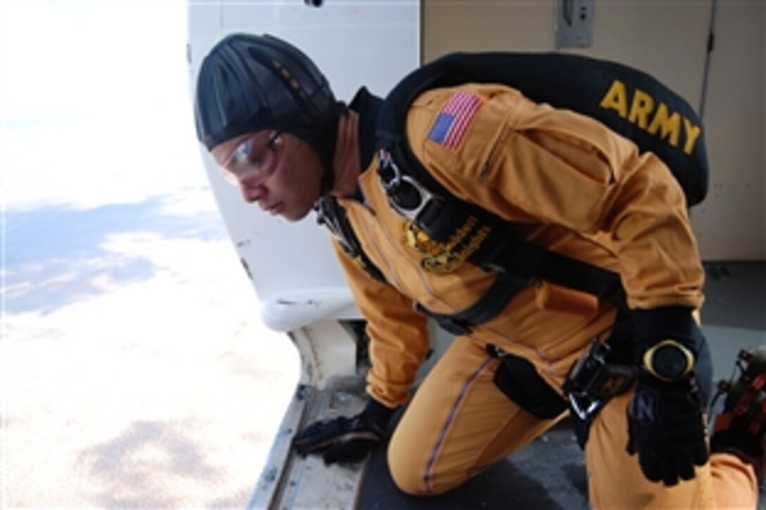 U.S. Army Staff Sgt. Brandon Valle, a Gold Team demonstration parachutist assigned to the U.S. Army Golden Knights, spots his landing area at the Amigo Airsho on Biggs Army Airfield, Fort Bliss, Texas, Oct. 8, 2008 