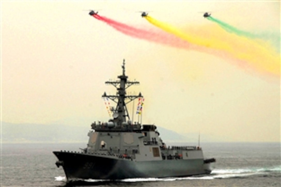 Helicopters fly over the Republic of Korea Aegis destroyer Sejong the Great during the International Fleet Review "Pass and Review", Pusan, Republic of Korea, Oct. 7, 2008. The International Fleet Review, which runs Oct. 5 through Oct. 10, 2008, celebrates the 60th anniversary of the Republic of Korea.