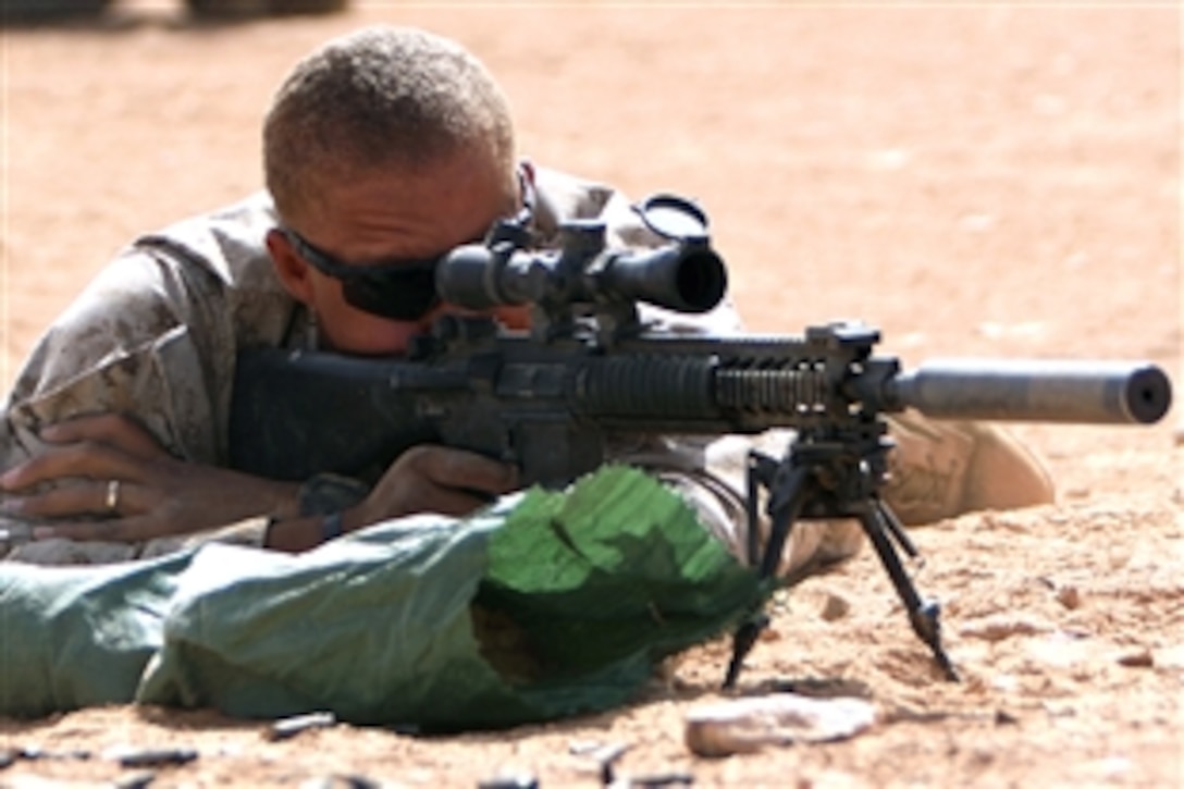 U.S. Marine Corps Sgt. Ernest C. Browne takes aim on targets down range on Camp Korean Village, Iraq, Oct. 5, 2008. Browne is a designated marksman assigned to the Security Forces Platoon, Headquarters and Service Company, 1st Light Armored Reconnaissance Battalion, Regimental Combat Team 5. “Our weapons are the most important piece of gear we have, so taking the time to get it ready is vital to whatever mission we have,” said Browne.