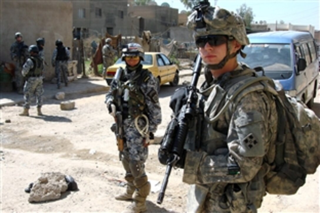 U.S. Army Pfc. Jacob Kahler pulls security on patrol during a search for a Special Groups extremist in the New Baghdad Security District of eastern Baghdad, Iraq, Oct. 4, 2008. The soldiers are assigned to Company A, 1st Battalion, 66th Armored Regiment, 1st Brigade Combat Team, 4th Infantry Division, attached to 4th Brigade Combat Team, 10th Mountain Division.