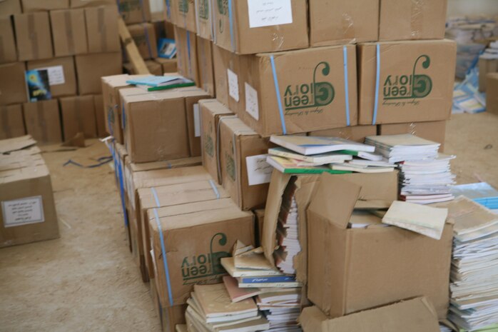 RAMADI, Iraq -- Service members with the embedded Provincial Reconstruction Team, Regimental Combat Team 1, meet with the Mayor and the Deputy of Education for Ramadi, Iraq, to donate educational books to local schools throughout the city Oct. 9. (Official Marine Corps photo by Cpl. Chris T. Mann) (Released)