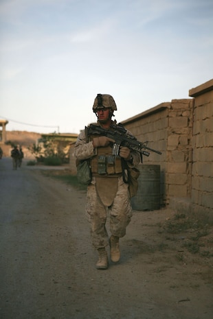 Sgt. Dante R. Sevieri, a squad leader with Provisional Rifle Platoon 3, Regimental Combat Team 5, leads a patrol in Rawah, Iraq, Oct. 20, keeping an eye out for any unusual activity. The platoon, made up of both non-infantry and infantry Marines, is in charge of two traffic control points near Rawah. ::r::::n::
