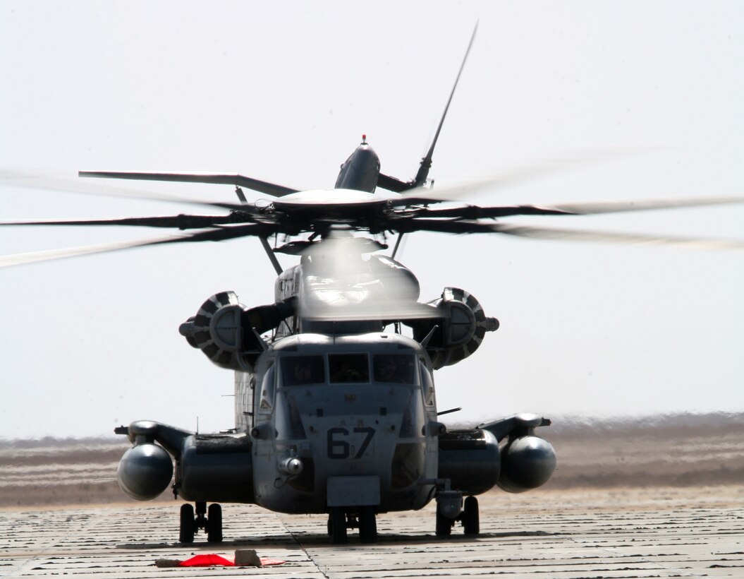 A CH-53E Super Stallion with Marine Heavy Helicopter Squadron 462 lands at a remote helicopter landing pad in al-Anbar Province Oct. 9. Two Super Stallions with the 3rd Marine Aircraft Wing (Forward) squadron refueled vehicles of the 1st Light Armored Reconnaissance Battalion.