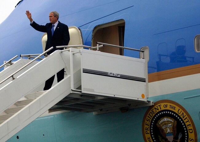 President George Bush waves to the crowd from Air Force One on the Charleston Air Force Base, S.C., flightline Oct. 10. President Bush met with more than 250 Team Charleston members en route to an event at Kiawah Island, S.C. (U.S. Air Force photo/Airman 1st Class Timothy Taylor)