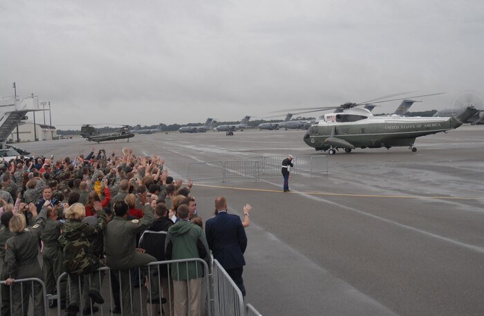 Members of Team Charleston wave to President George Bush as he departs in marine One from Charleston Air Force Base, S.C., Oct 10. President Bush met with more than 250 members of Team Charleston en route to an event at Kiawah Island, S.C. (U.S. Air Force photo/Staff Sgt. Sam Hymas)