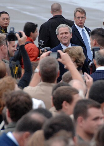 President George Bush winks at the crowd on the Charleston Air Force Base, S.C., flightline Oct. 10. President Bush met with more than 250 Team Charleston members en route to an event at Kiawah Island, S.C. (U.S. Air Force photo/Airman 1st Class Katie Gieratz)