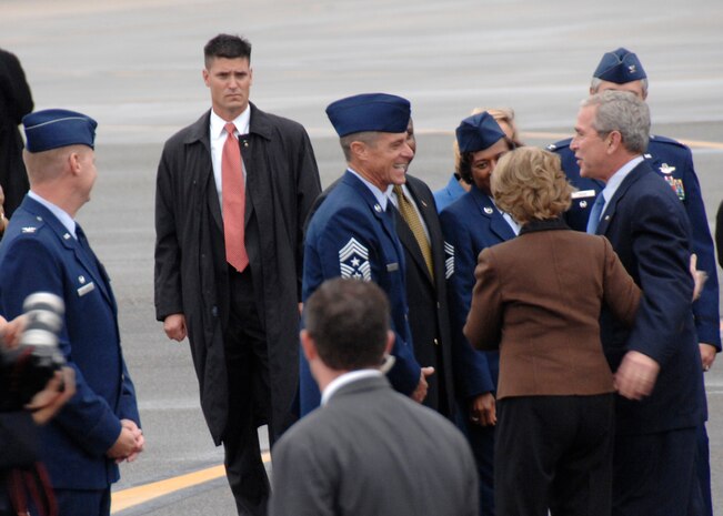 President George Bush and First Lady Laura Bush mingle with Team Charleston leaders on the Charleston Air Force Base, S.C., flightline Oct. 10. President Bush met with more than 250 Team Charleston members en route to an event at Kiawah Island, S.C. (U.S. Air Force photo/Airman 1st Class Katie Gieratz)