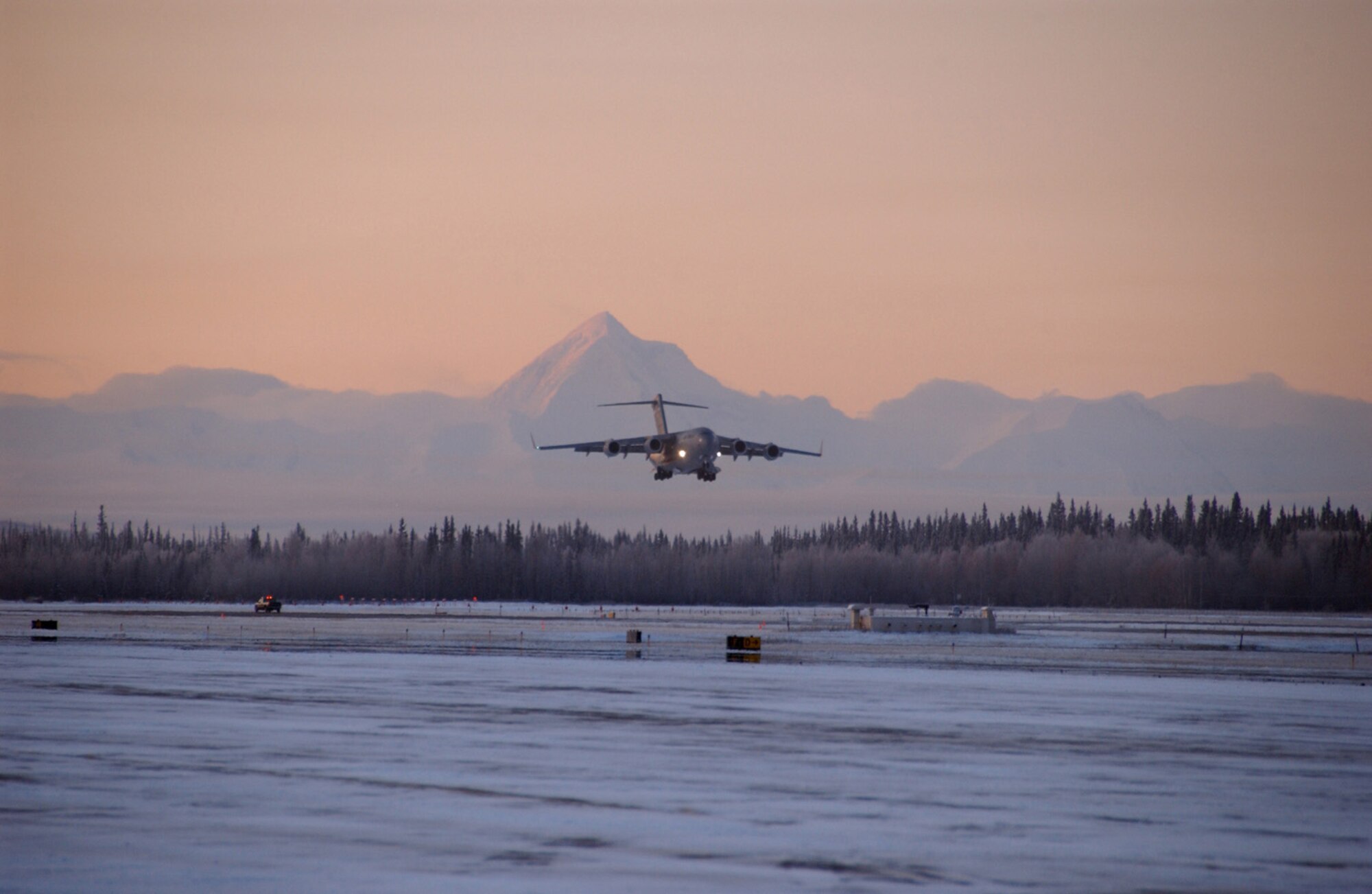 A C-17 Globemaster III prepares for landing Oct. 9,2008, at Eielson Air Force Base, Alaska. The C-17 is carrying military foreign officers to tour Eielson AFB and to see what the Air Force accomplishes in the arctic environment. (U.S. Air Force photo by Airman Laura Max)