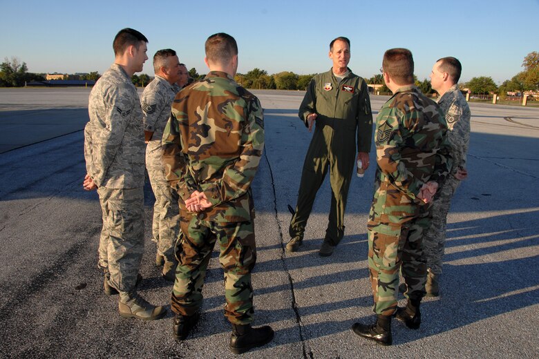 OFFUTT AIR FORCE BASE, Neb. -- Brig. Gen. James J. Jones, commander 55th Wing, talks to airmen assigned to U.S. Strategic Command after they completed a luggage detail.  The detail was for generals departing Offutt AFB, Neb., following a CAPSTONE, three-day tour of U.S. Strategic Command Headquarters, Oct. 10.  CAPSTONE is a Department of Defense joint service professional military education course for newly promoted brigadier generals and rear admirals serving in the U.S. military. (U.S. Air Force Photo By Josh Plueger)
