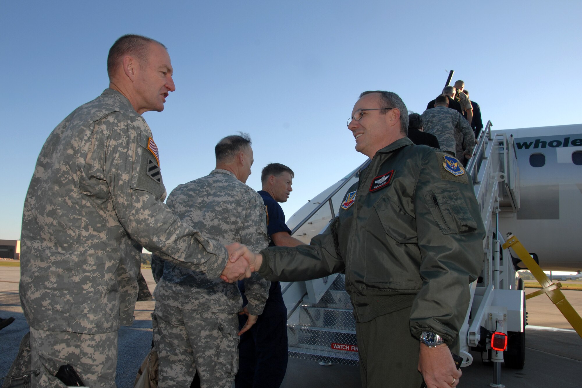 OFFUTT AIR FORCE BASE, Neb. -- Colonel Robert L. Maness, vice commander 55th Wing, bids farewell to members of the three-day CAPSTONE tour of U.S. Strategic Command Headquarters.  Attendees departed Offutt AFB, Neb., Oct. 10.  CAPSTONE is a Department of Defense joint service professional military education course for newly promoted brigadier generals and rear admirals serving in the U.S. military. (U.S. Air Force Photo By Josh Plueger)