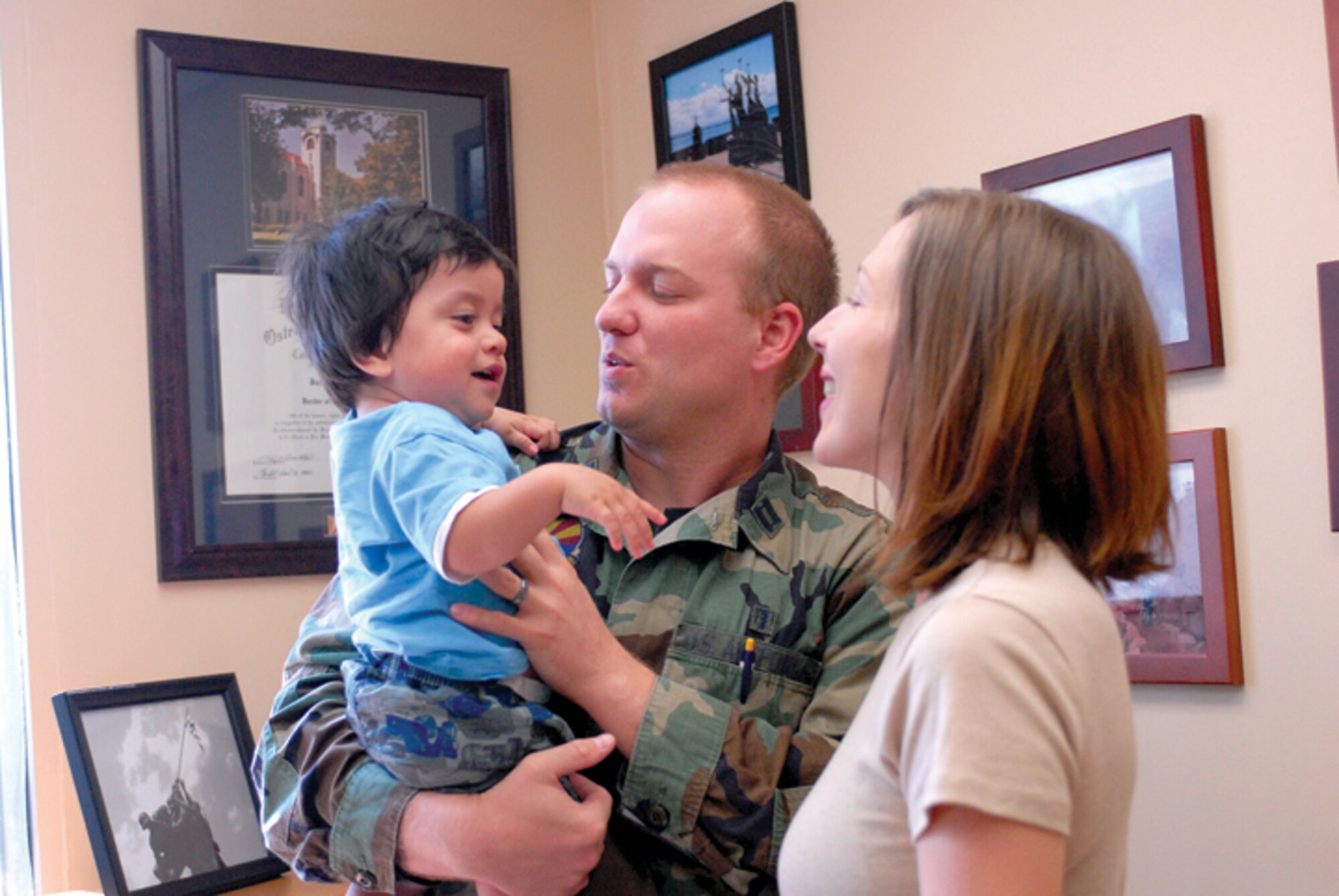 Capt. Jacob Allgood and his wife, LeAnn, adopted Luke, 14 months, from Guatamala. After over a year of paper work and waiting, the Allgoods brought Luke home to Arizona in September. (U.S. Air Force photo/Deborah Silliman-Wolfe.)