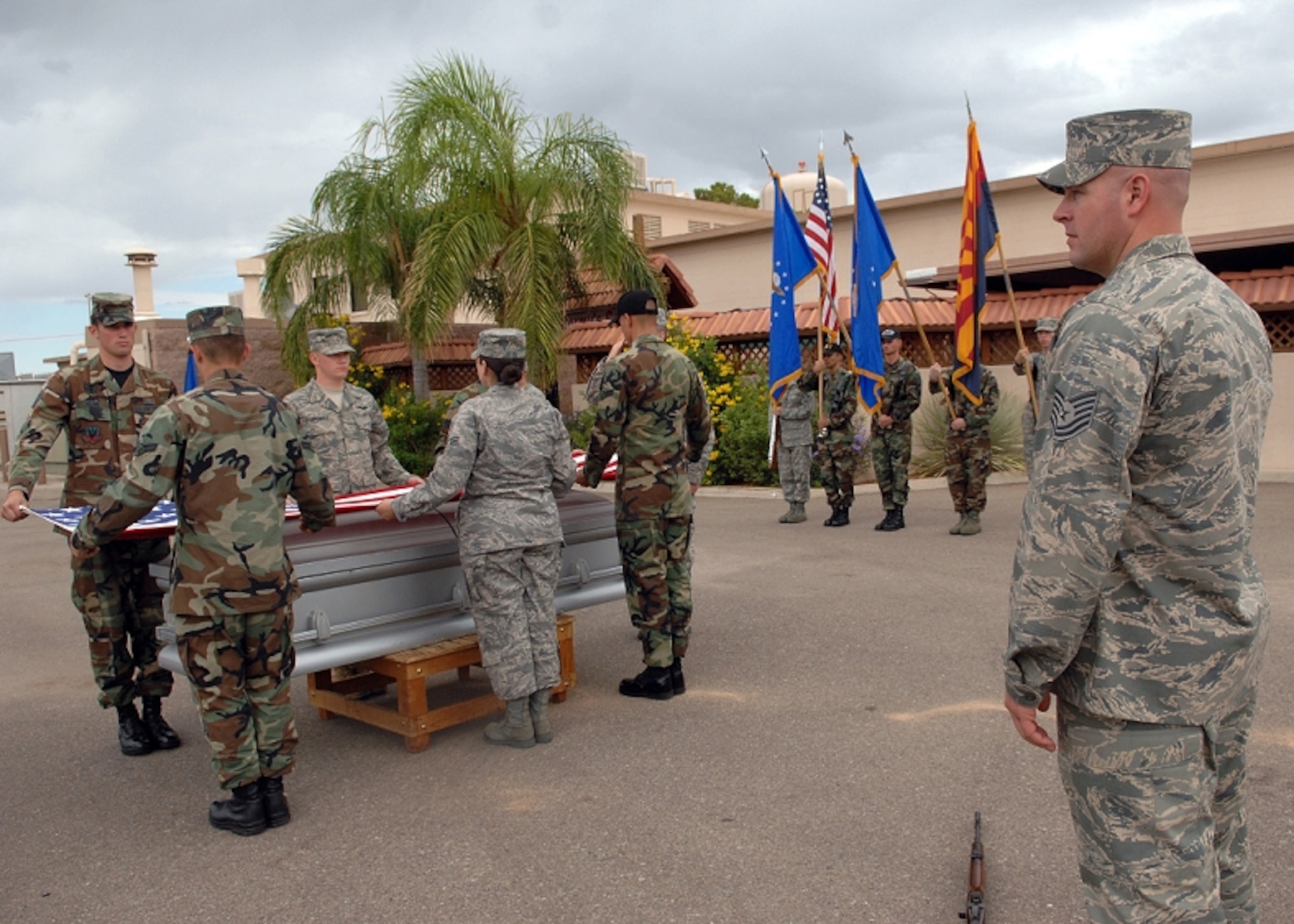Tech Sgt. Toby Farr, right, U.S. Air Force Honor Guard formal training instructor, watches as base honor guardsmen practice a funeral sequence during a training visit to Davis-Monthan Air Force Base, Ariz. (Photo courtesy of U.S. Air Force Honor Guard)
