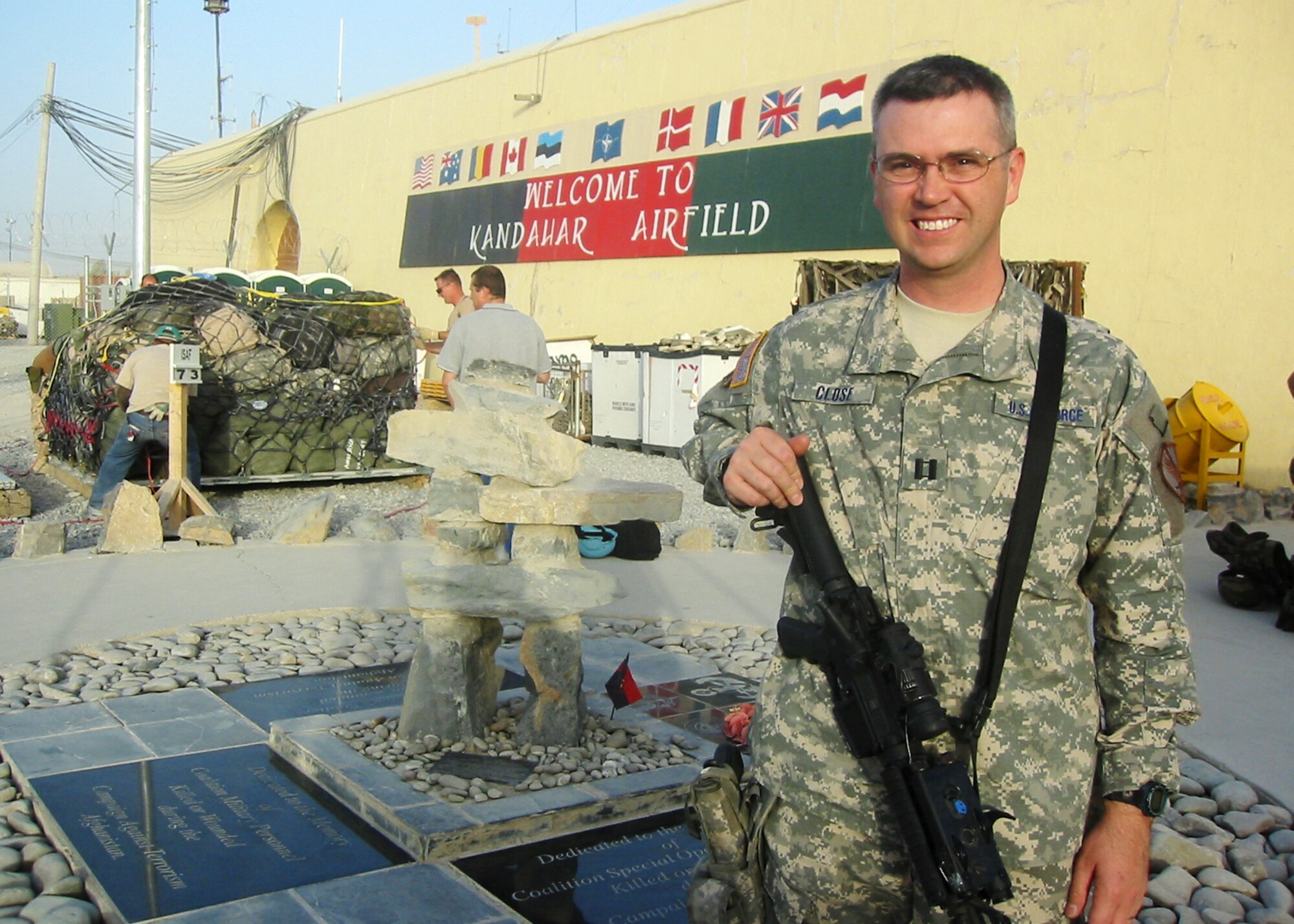KANDAHAR AIR BASE, Afghanistan – Capt. Carl Close, a 92nd Logistics Readiness officer, poses in front of a memorial on Kandahar Air Base during his recent deployment to Afghanistan. Captain Close was bestowed the Bronze Star shortly after his arrival home for meritorious service in a combat zone. The Bronze Star is the nation’s fourth highest honor for meritorious service. (U.S. Air Force courtesy photo)