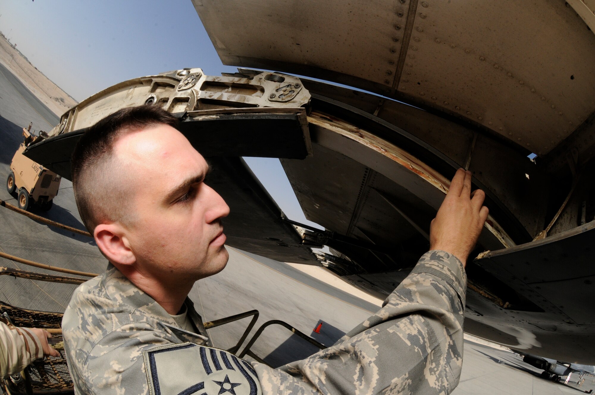 Master Sgt. Charles Havenner, 379th Expeditionary Maintenance Operations Squadron, checks a flat spot on the flap carriage track Oct. 7 at an undisclosed location in Southwest Asia. The EMOS analyzes maintenence problems looking for trends and preventive measures. There are seperate analysts for each of the airframes stationed here.  (U.S. Air Force photo by Tech. Sgt. Michael Boquette)