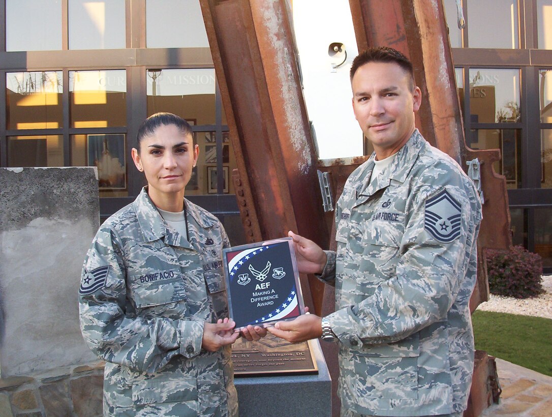 SEYMOUR JOHNSON AIR FORCE BASE, N.C. -- Senior Master Sgt. Brian Bischoff, a Reservist with the 916th Communications Squadron, is currently deployed to Tyndall Air Force Base, FL on an Air Expeditionary Force rotation. Here Sgt. Bischoff presents the newly created ?AEF Making a Difference Award."  He created this award to recognize the efforts of AEF members deployed to Tyndall who go above and beyond in their efforts.  The first recipient is Tech. Sgt. Bonifacio, an active duty member from Kirtland Air Force Base.  Sgt. Bonifacio was recognized as working tirelessly to become station qualified in record time while providing outstanding support and mentorship to other AEF members during recent hurricane ops. 

