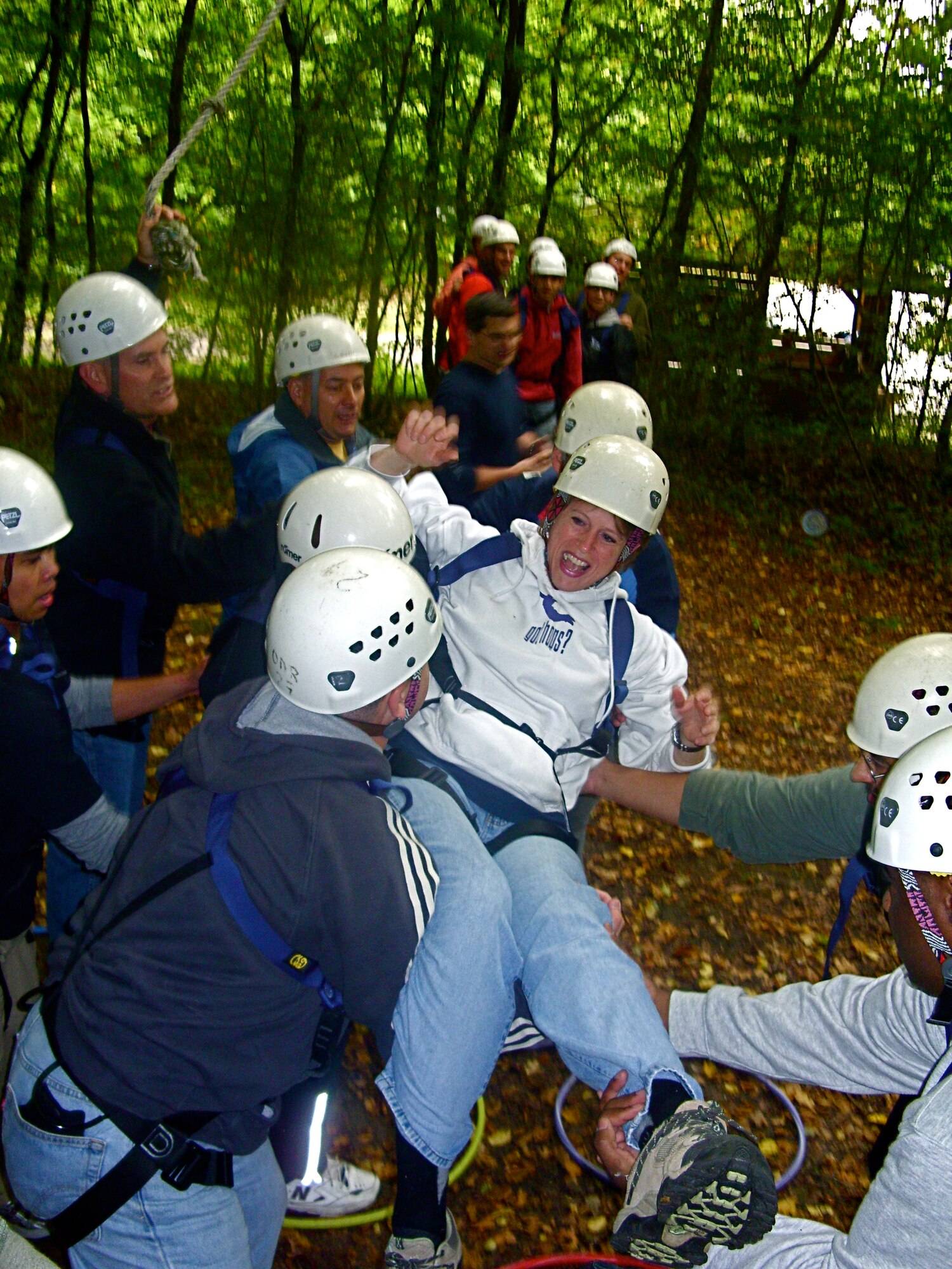 SPANGDAHLEM AIR BASE, Germany -- Ropes course participants help one another during a team building challenge for the leadership course that is designed to enhance communication and promote team-problem solving. The 52nd Force Support Squadron provided resources for the members from the 52nd Munitions Maintenance Group who attended the course.