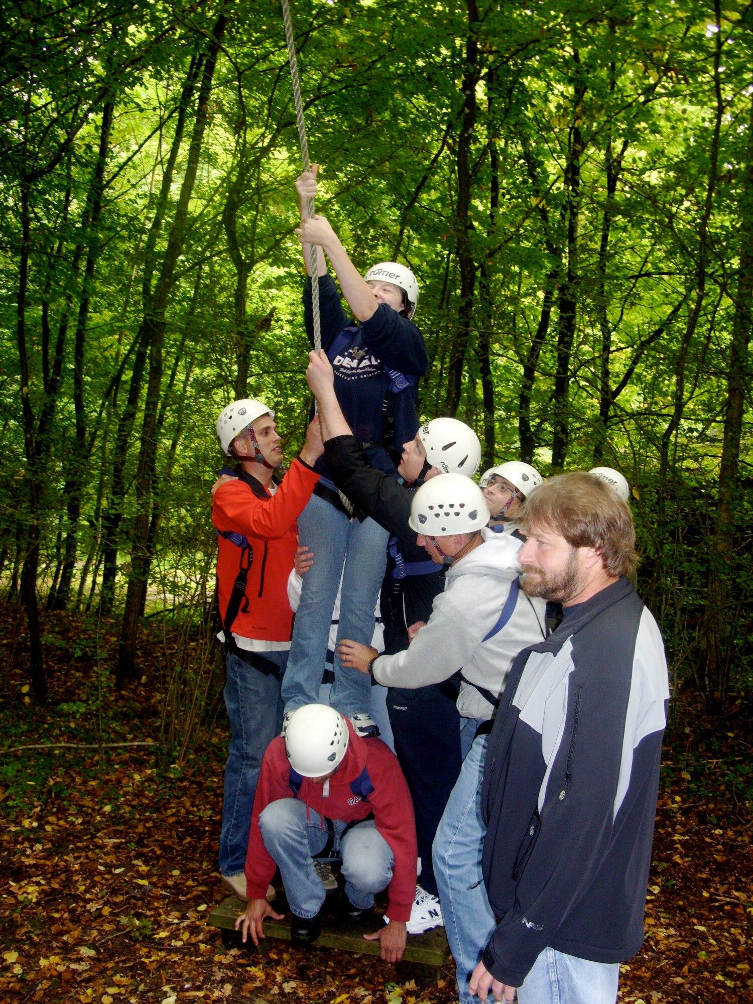 SPANGDAHLEM AIR BASE, Germany -- Ropes course participants help one another during a team building challenge for the leadership course that is designed to enhance communication and promote team-problem solving. The 52nd Force Support Squadron provided resources for the members from the 52nd Munitions Maintenance Group who attended the course.