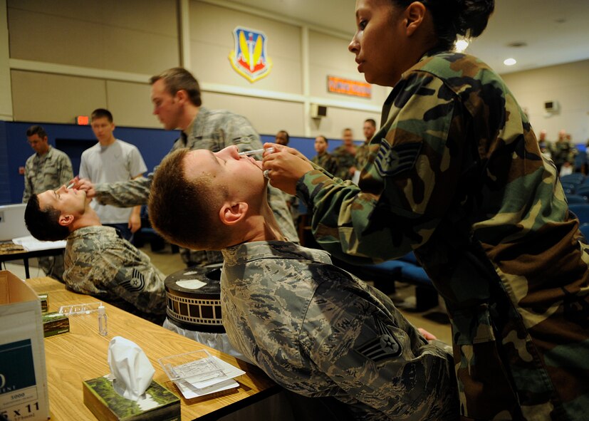 MOODY AIR FORCE BASE, Ga. -- Airmen of the 23rd Wing receive intranasal flu mist here Oct. 7. The 23rd Medical Group administered the flu mist to active duty personnel in the base theater for two days before the start of "flu season." (U.S. Air Force photo by Senior Airman Brittany Barker)