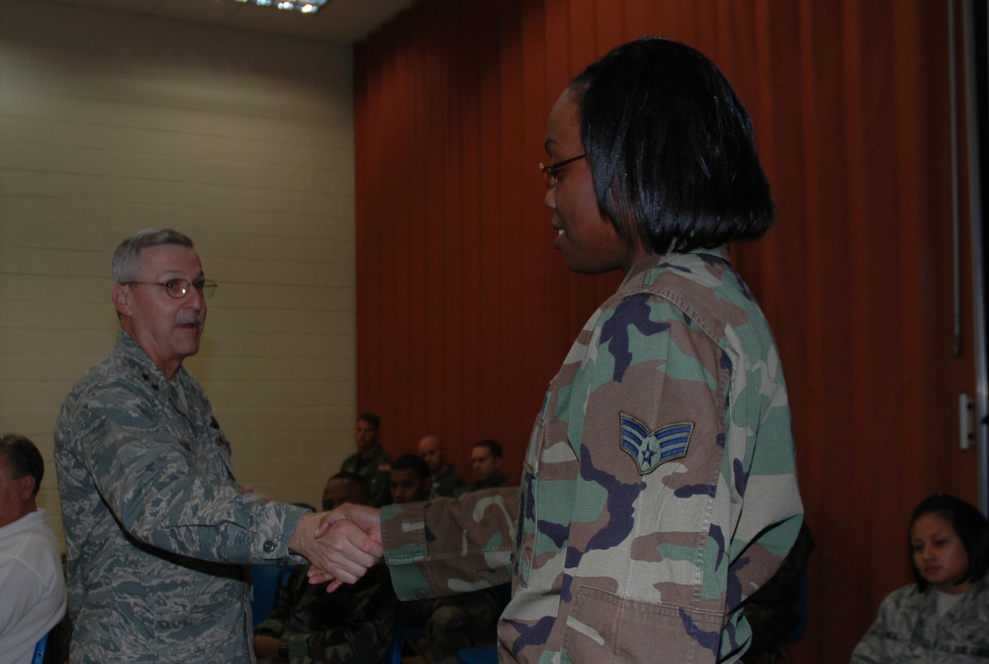 MCGUIRE AIR FORCE BASE, N.J. - Maj. Gen. Martin M. Mazick, commander, 22nd Air Force, Dobbins Reserve Air Base, Ga., welcomes SrA Stephanie Blango of the  514th Security Force Squadron, to the Reserve at the newcomers briefing here.  General Mazick met with members and toured various units throughout the wing on his visit during the October unit training assembly. (U.S.Air Force photo/Staff Sgt. Monica Dalberg)