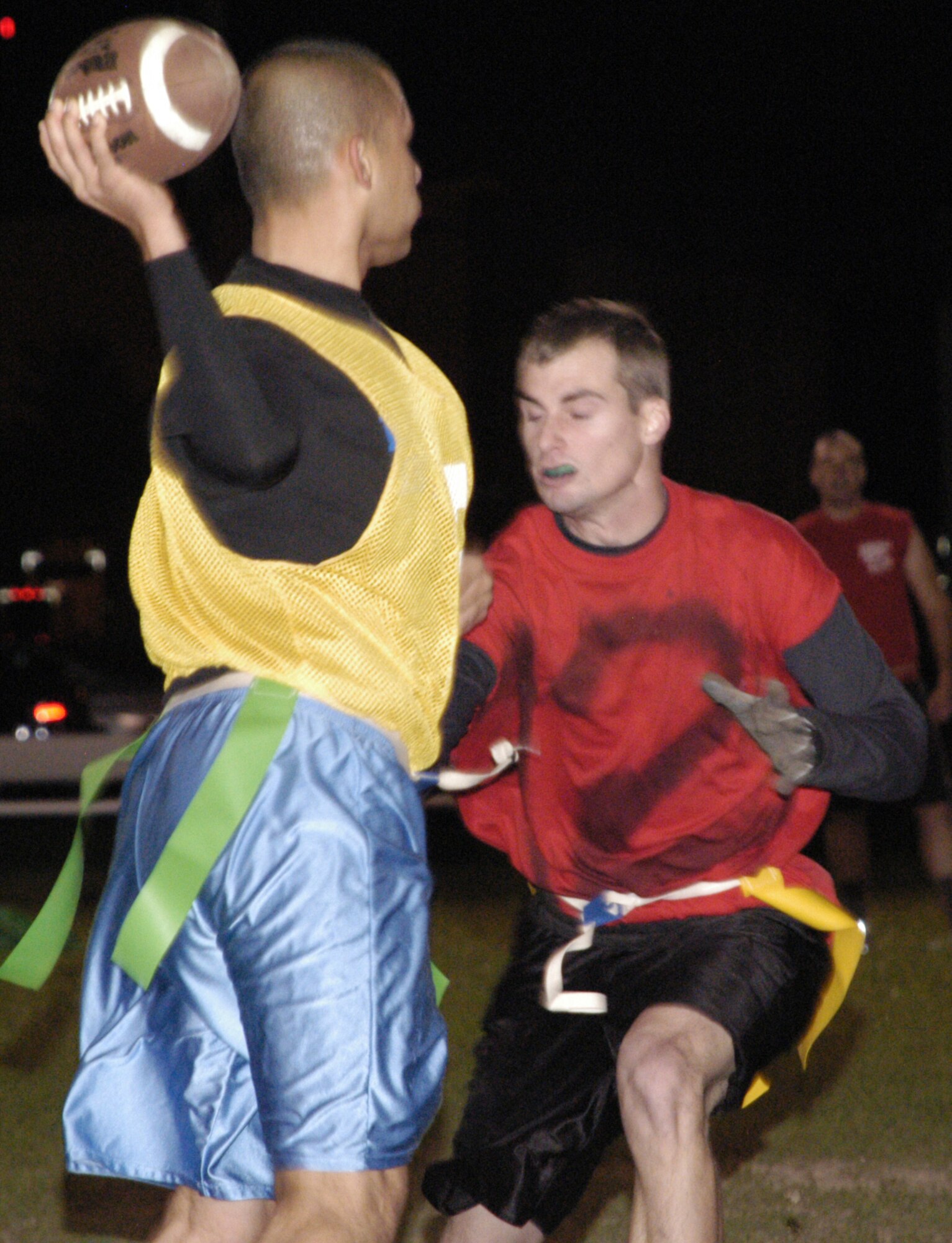 Christopher Jeanes, LRS wide reciever and defensive back, sacks Phillip Johnson, MSS assistant coach and quarterback, during their first flag football game Oct. 7.  LRS defeated MSS 20-7.  (U.S. Air Force photo / Airman 1st Class Shen-Chia Chu)                                 