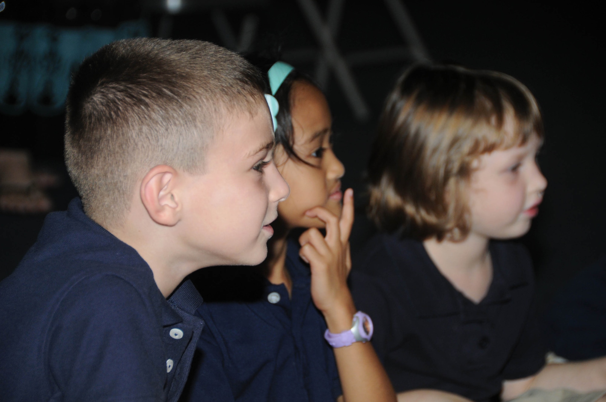 ANDERSEN ANDERSEN AIR FORCE, Guam - Andersen Elementary School students anxiously await the arrival of "Scruffy," the fire prevention dog, during Fire Prevention Week here Oct. 9. Airmen from the fire department educated children on the importance of fire safety and the proper procedures to take in case of a fire. (U.S. Air Force photo by/Senior Airman Sonya Croston)