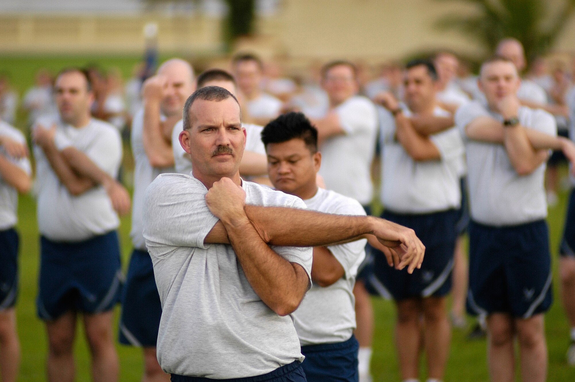 ANDERSEN AIR FORCE BASE, Guam – Senior Master. Sgt. Darron Williams, 36th Operations Support Squadron, calls out stretches before the start of the Team Andersen wing run here Oct. 10. The 36th Wing participates in a monthly 1.5 mile run to enhance esprit de corps, teamwork and readiness.  (U.S. Air Force photo by Master Sgt. Lisa M. Zunzanyika)