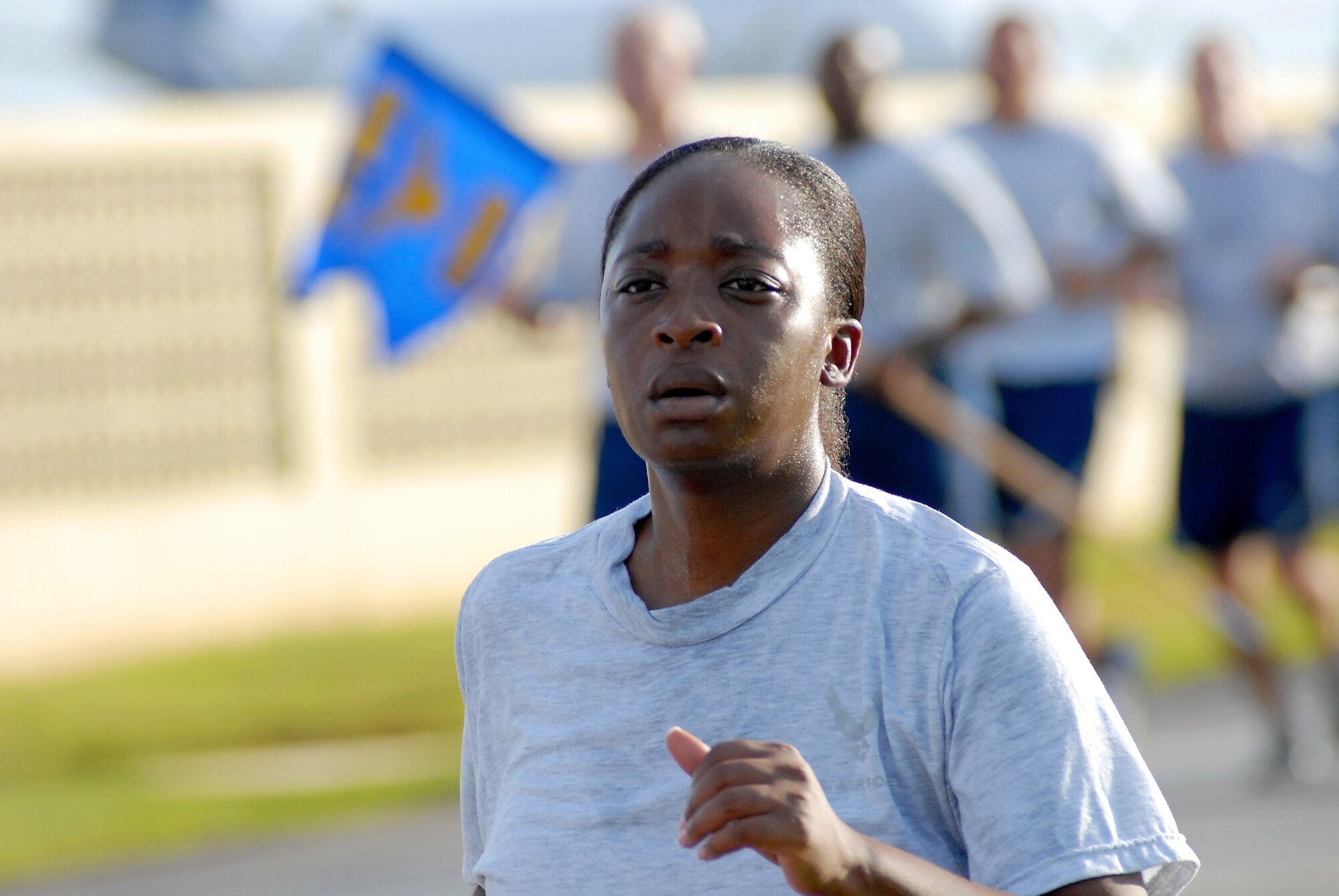 ANDERSEN AIR FORCE BASE, Guam – Senior Airman Shavonne Edwards works up a sweat during the Team Andersen wing run here Oct. 10. The 36th Wing participates in a monthly 1.5 mile run to enhance esprit de corps, teamwork and readiness.  (U.S. Air Force photo by Master Sgt. Lisa M. Zunzanyika)