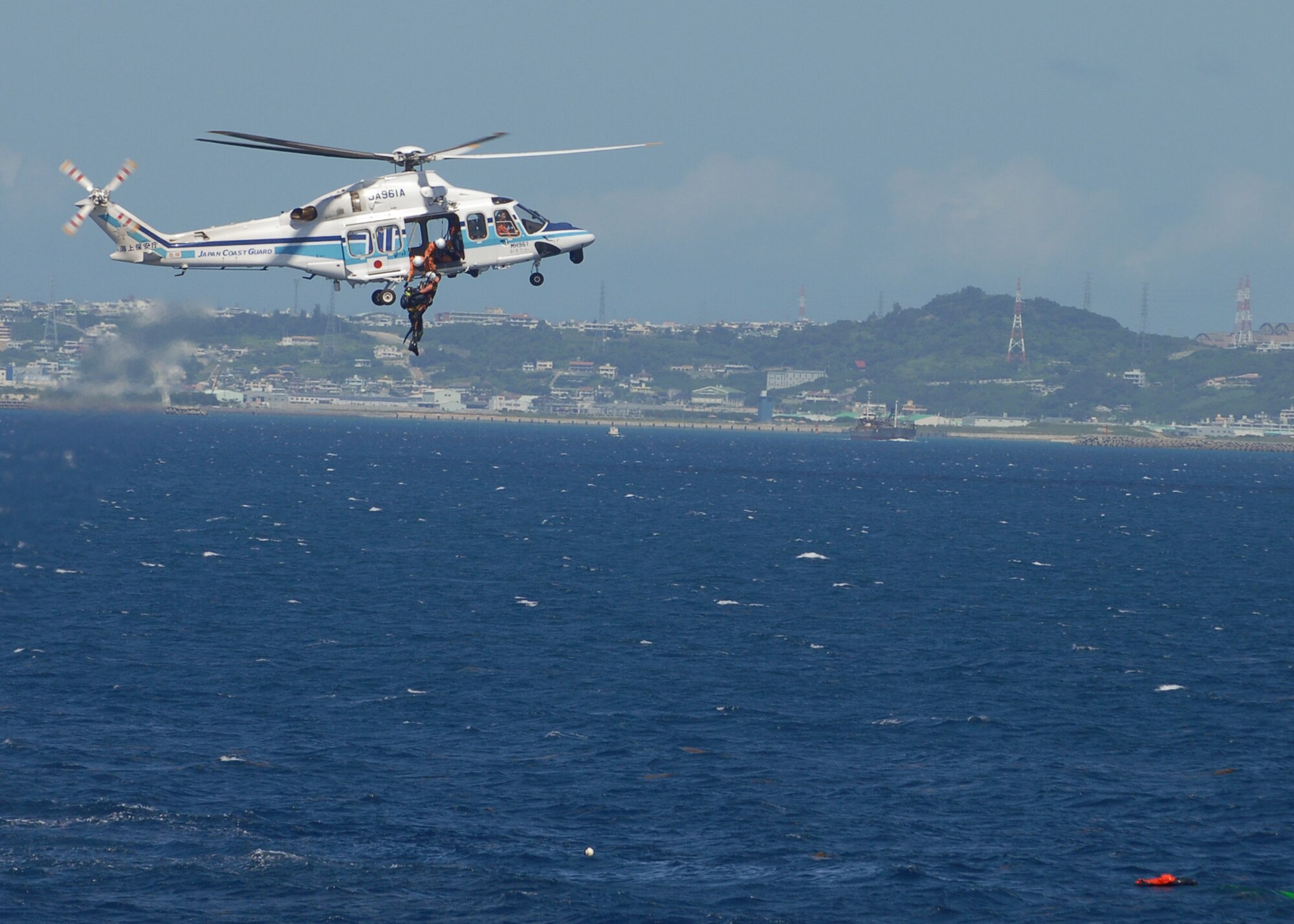 The Japanese Coast Guard rescues a downed pilot from a simulated F-15 crash during a crisis exercise off the coast of Okinawa Oct. 8, 2008. U.S. Air Force and Japanese Coast Guard assets rehearsed response procedures for an over the water accident. (U.S. Air Force photo/Airman 1st Class Amanda Grabiec)