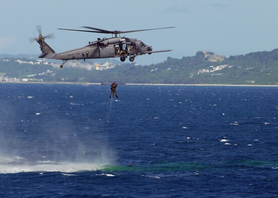 The 33rd Rescue Squadron hovers over one of two downed pilots during a simulated crisis management exercise off the coast of Okinawa Oct. 8, 2008. U.S. Air Force and Japanese Coast Guard assets rehearsed response procedures for an over the water aircraft accident. (U.S. Air Force photo/Airman 1st Class Amanda Grabiec)