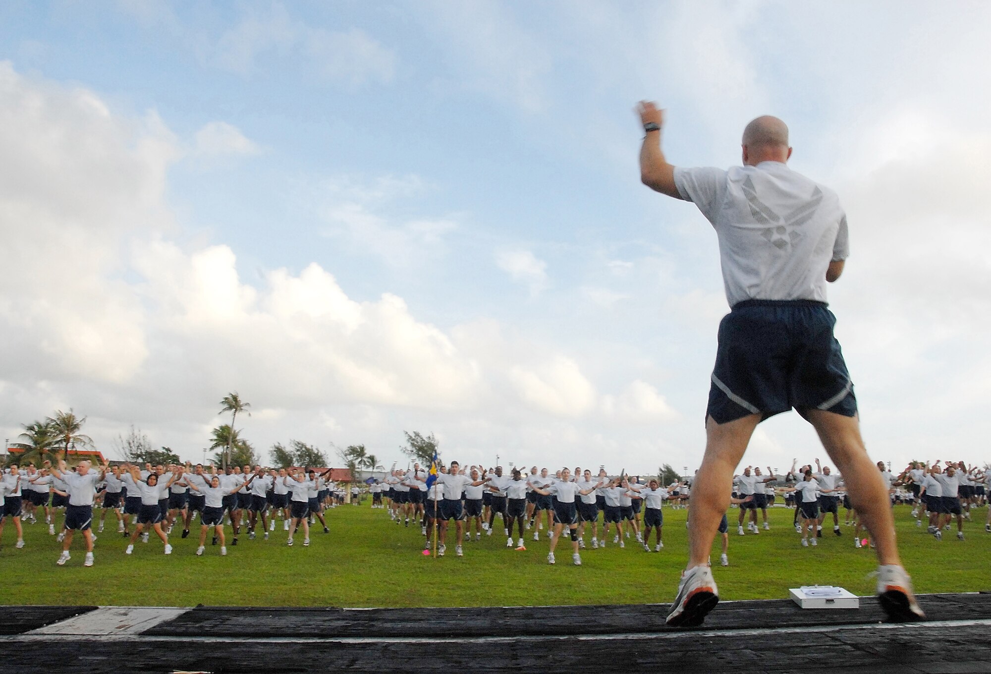 ANDERSEN AIR FORCE BASE, Guam - Master Sgt. Anthony Cruz-Munoz, 36th Civil Engineer Squadron first sergeant, leads Team Andersen through the stretching segment of the monthly wing run here Oct. 10. The 36th Wing participates in a monthly 1.5 mile run to enhance esprit de corps, teamwork and readiness.  (U.S. Air Force photo by Master Sgt. Lisa M. Zunzanyika)