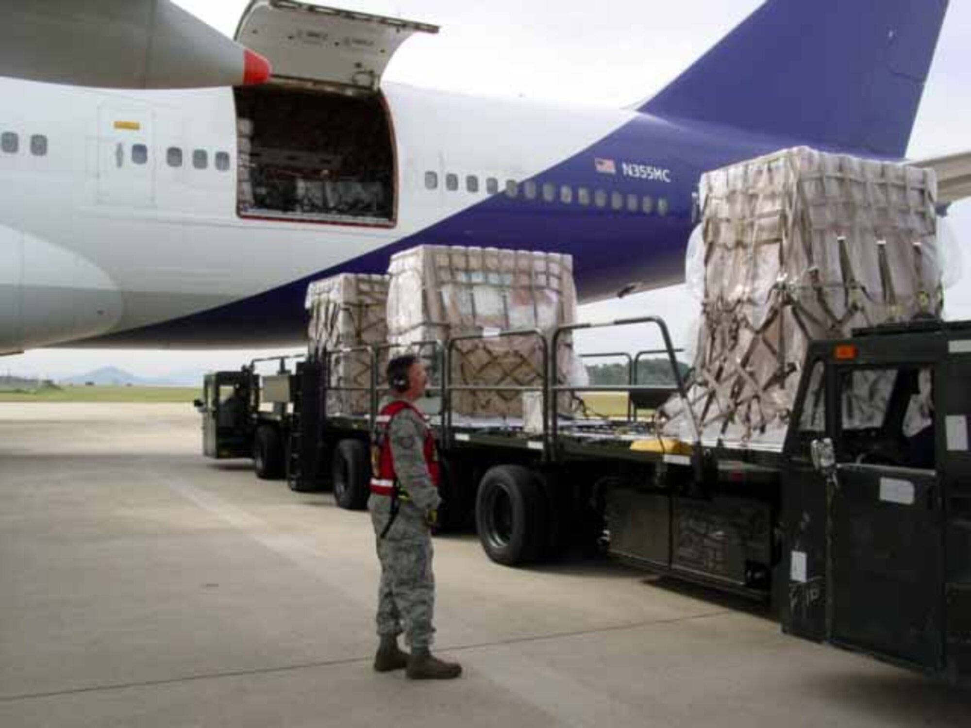KUNSAN AIR BASE, Republic of Korea --Members of the 731st Air Mobility Squadron load cargo onto aircraft. Twenty-five personnel from the 731st Air Mobility Squadron temporary “deployed” to Kunsan Air Base, Republic of Korea, Sept. 21 Sept to Oct. 1, for a training event designed to enhance the unit’s mission capabilities and efficiency. (U.S. Air Force photo) 