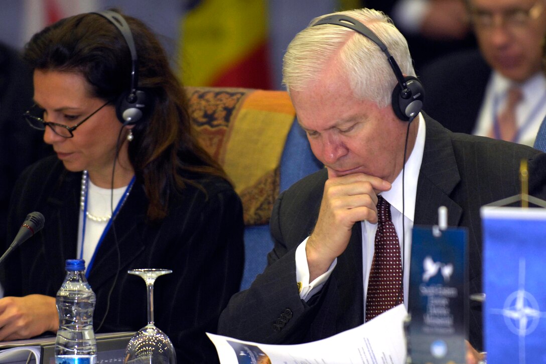 U.S. Defense Secretary Robert M. Gates, right, and Assistant Secretary of Defense for International Security Affairs Mary Beth Long listen to the opening remarks of the Southeastern European Defense Ministerial in Ohrid, Macedonia, Oct. 8, 2008.
