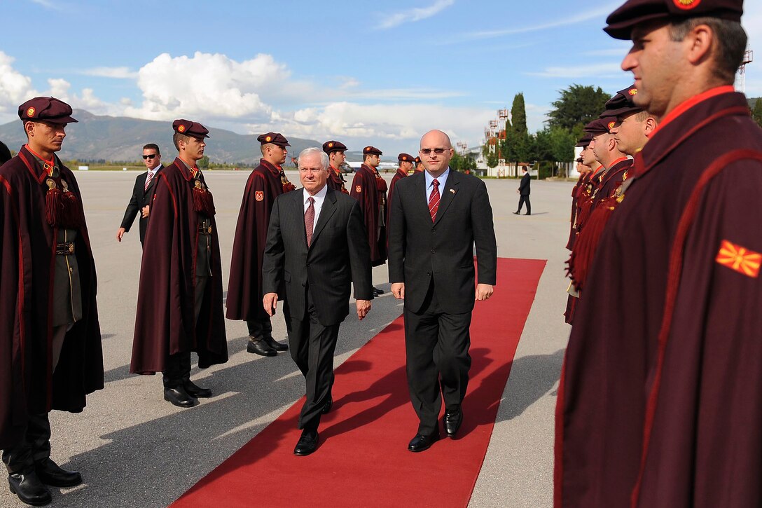 U.S. Defense Secretary Robert M. Gates walks though an honor cordon of Macedonian special guardsman after attending the Southeastern European Defense Ministerial, Oct. 8, 2008, in Ohrid, Macedonia.