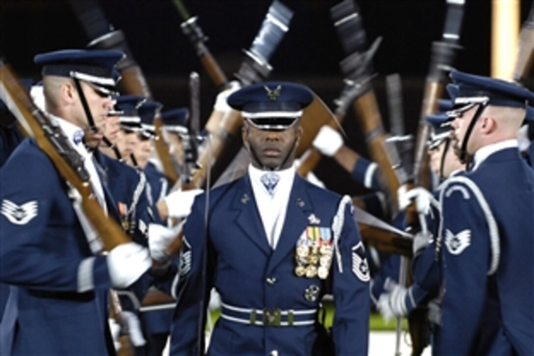 Members of the U.S. Air Force Drill Team perform during a rehearsal tattoo on Bolling Air Force Base, in Washington, D.C., Oct. 5, 2008.