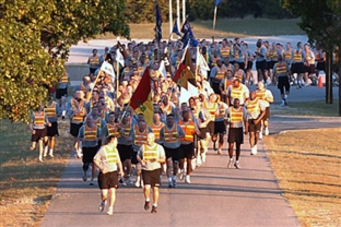 U.S. Army soldiers roar cadences as they return from an early morning unit run on Fort Hood, Texas, Oct. 9, 2008. The soldiers are assigned to the 1st Air Cavalry “Warrior” Brigade, 1st Cavalry Division. Before the run, Col. Douglas Gabram, commander of the Warriors, talked to his soldiers about the importance of safety, taking care of one another and spending quality time with their family this holiday weekend.